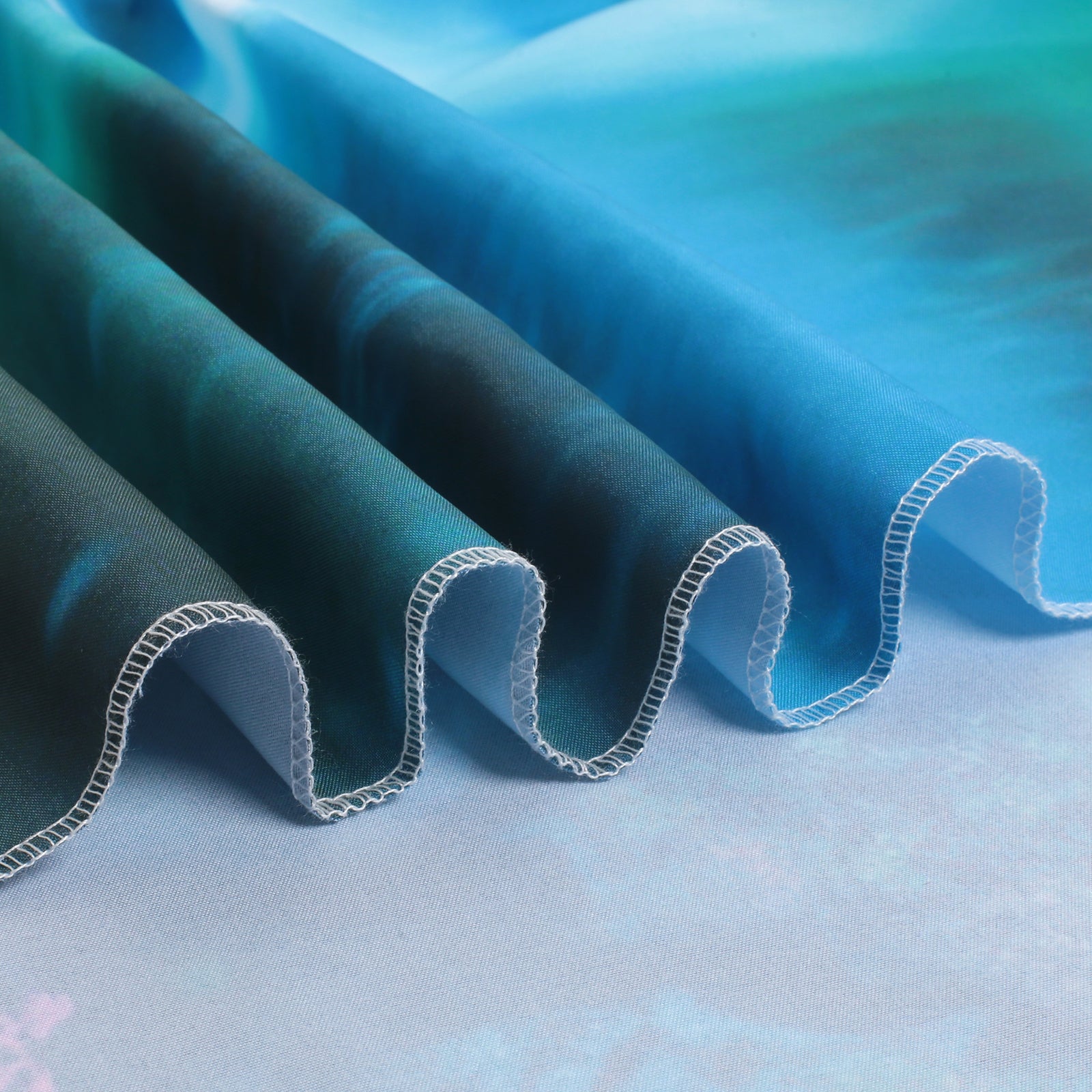 Close-up of fluorescent tapestry fabric texture, stitched edges, vivid waterfall print